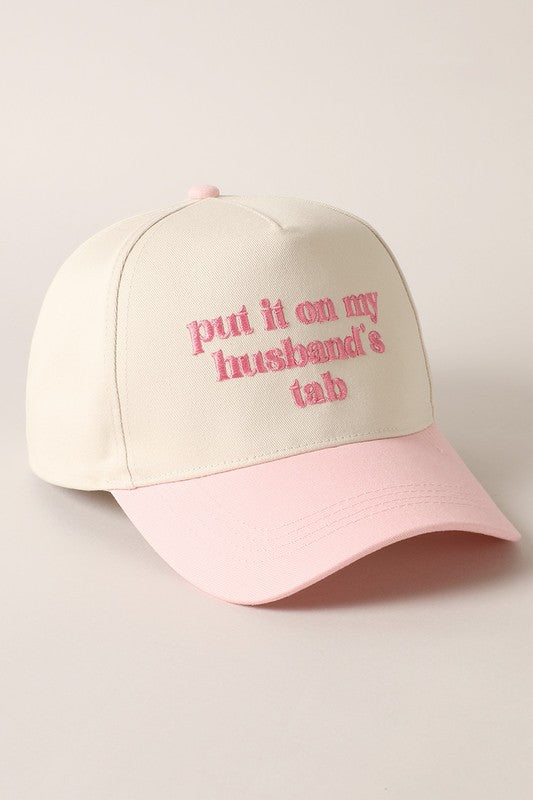 Put It On My Husband's Tab Embroidered Trucker Hat (pink)