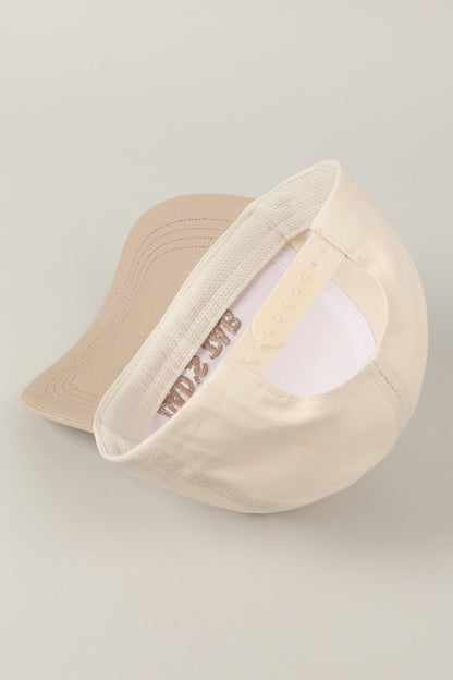Put It On My Mom's Tab Embroidered Trucker Hat (beige)