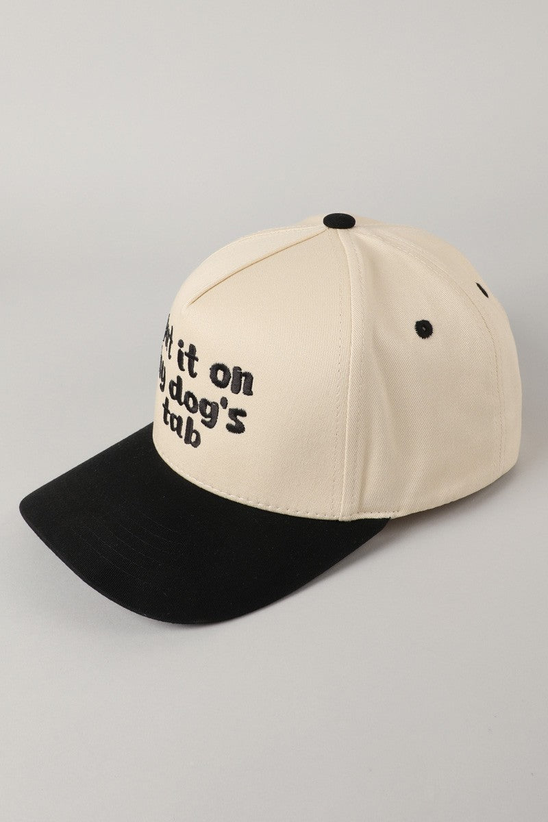 Put It On My Dog's Tab Embroidered Trucker Hat (black)
